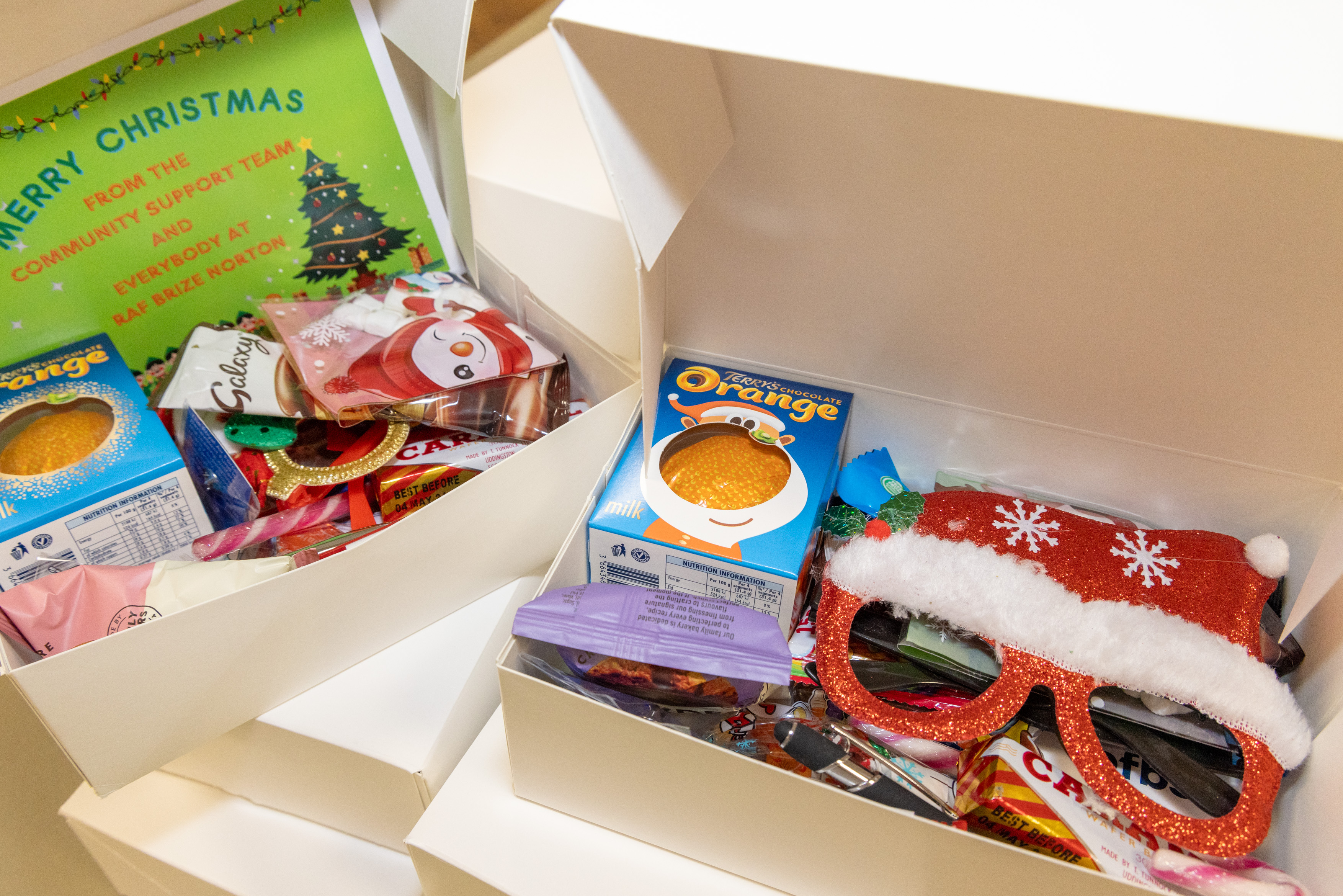Photo - Christmas boxes are ready for their journeys around the world.